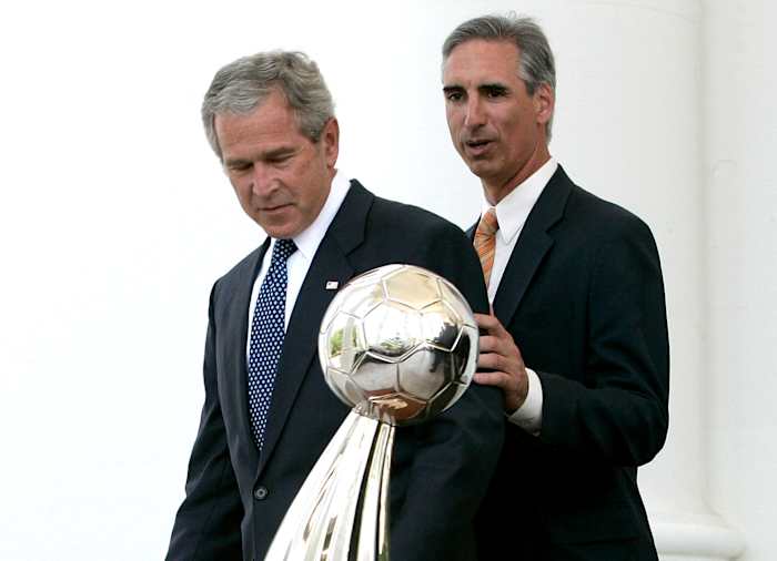Luck and President George W. Bush with the Houston Dynamo’s 2006 MLS Cup trophy, one of two MLS titles the team won during Luck’s tenure as GM.